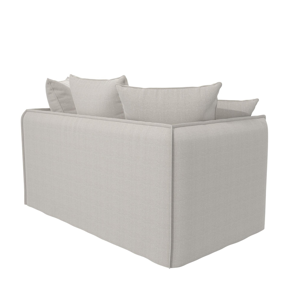 A side view of the Collette Slipcover Loveseat Sofa shows its light gray, rectangular design with high-density foam seating and two back cushions. With clean lines, a contemporary look, and a removable slipcover, it suits any modern living room.