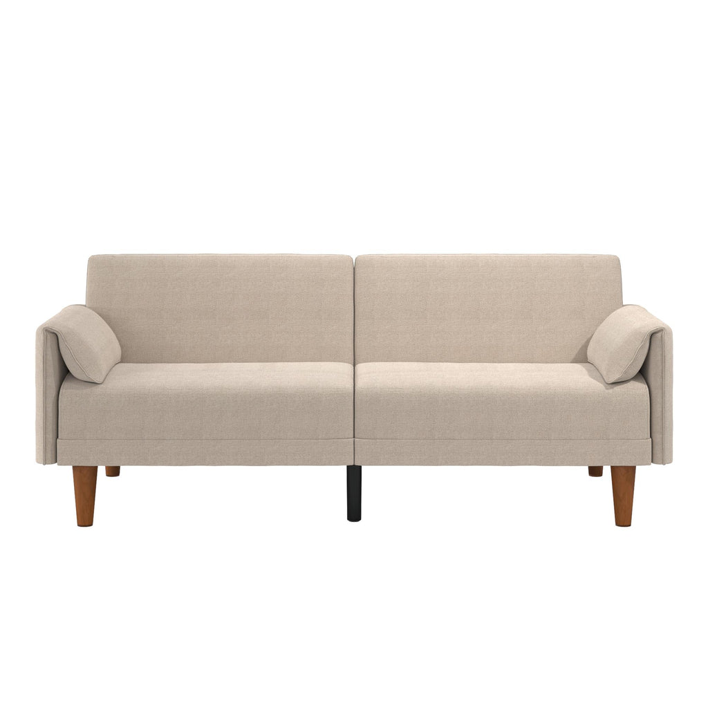 The Markham Futon is a modern beige midcentury couch with two seat cushions and low armrests. It features wooden legs—two brown, one black—for stylish contrast, and boasts a simple, minimalist design that effortlessly complements any space.