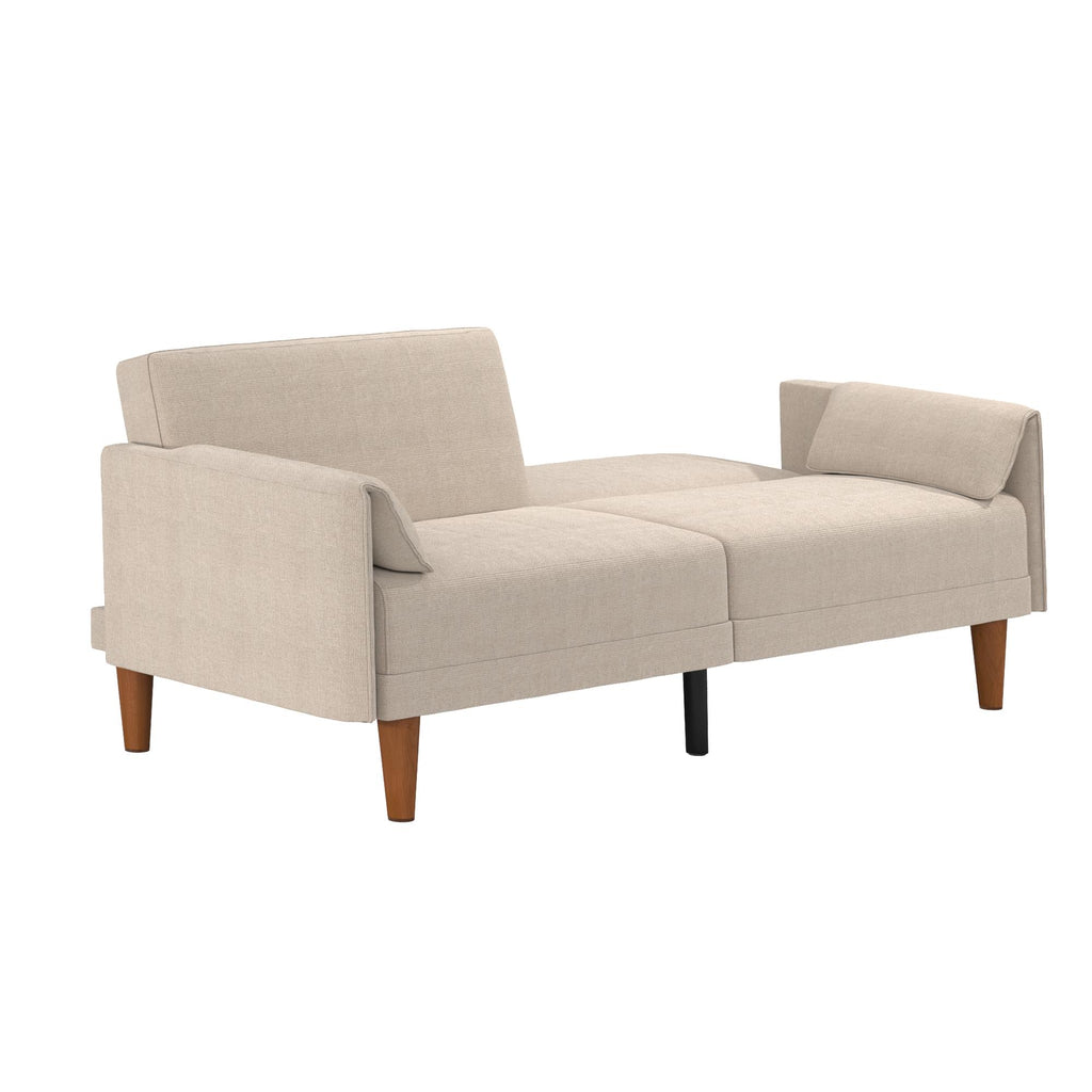 The Markham Futon is a modern beige loveseat with wooden legs, featuring a backrest and armrests. Its cushions have a smooth fabric surface, and its Scandinavian sleeper sofa design is minimalist, ideal for contemporary living spaces.