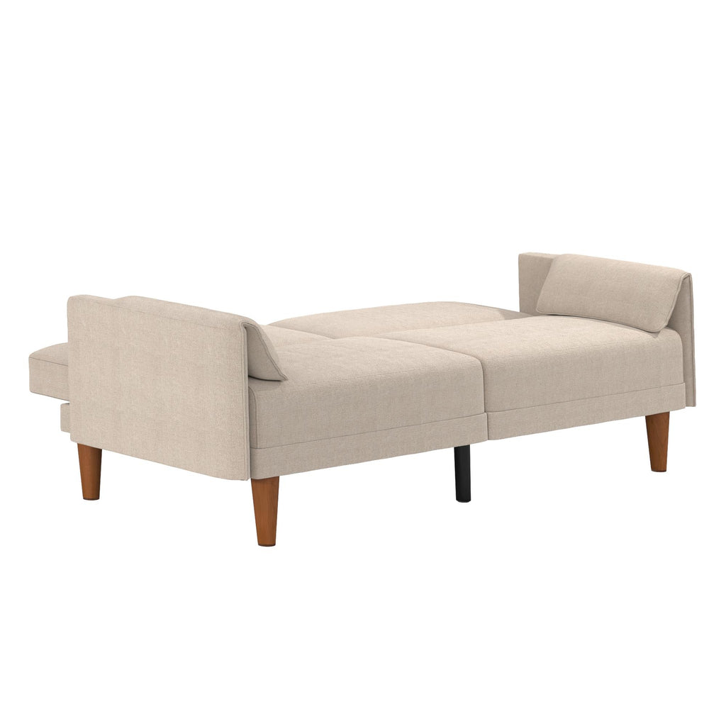 The Markham Futon is a beige convertible sofa bed with light brown wooden legs and a split-back design, embodying midcentury modern chic. This compact 2-seater apartment sofa easily converts into a bed, combining functionality with timeless appeal.