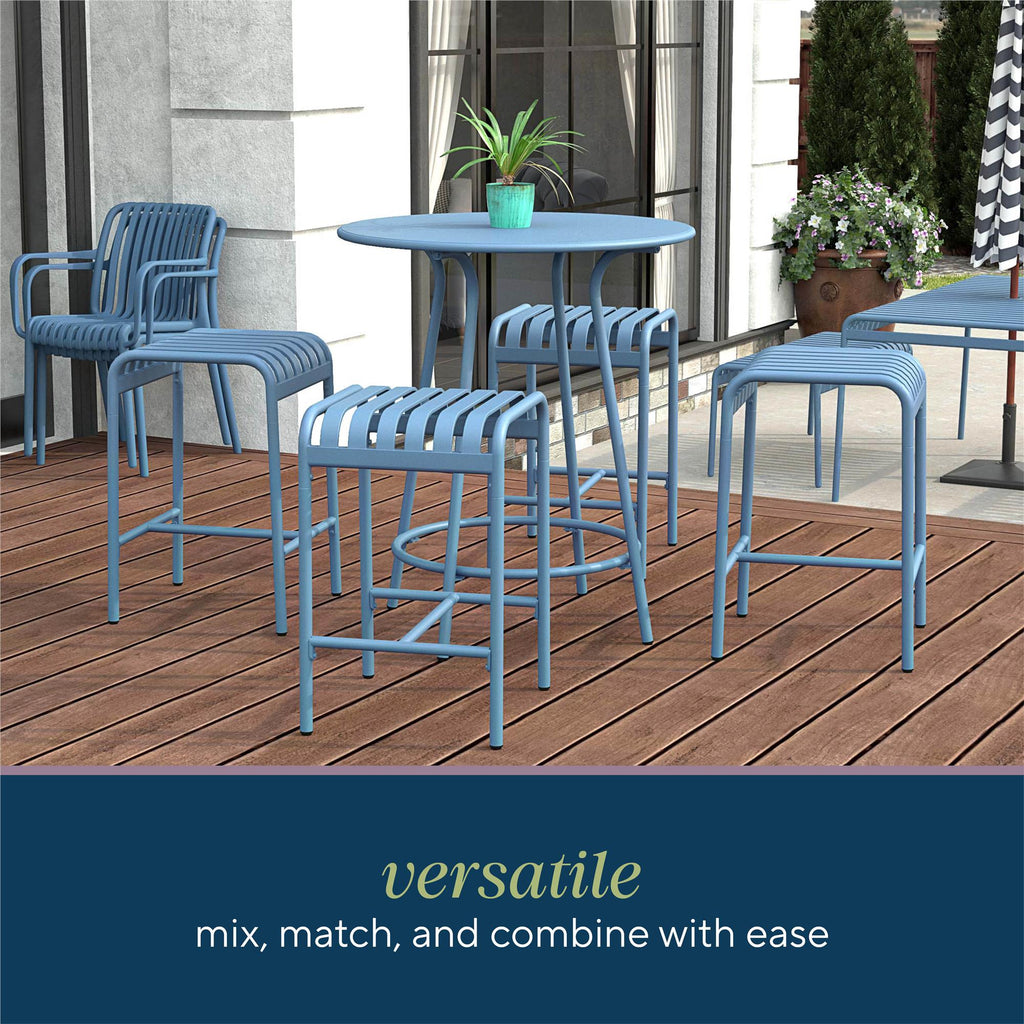 The Ola 5-Piece High Dining Set, crafted from premium steel, anchors this wooden deck. Surrounded by potted plants, it offers flexible seating options for mixing and matching. Additional seats can be seen in the backdrop for enhanced comfort.