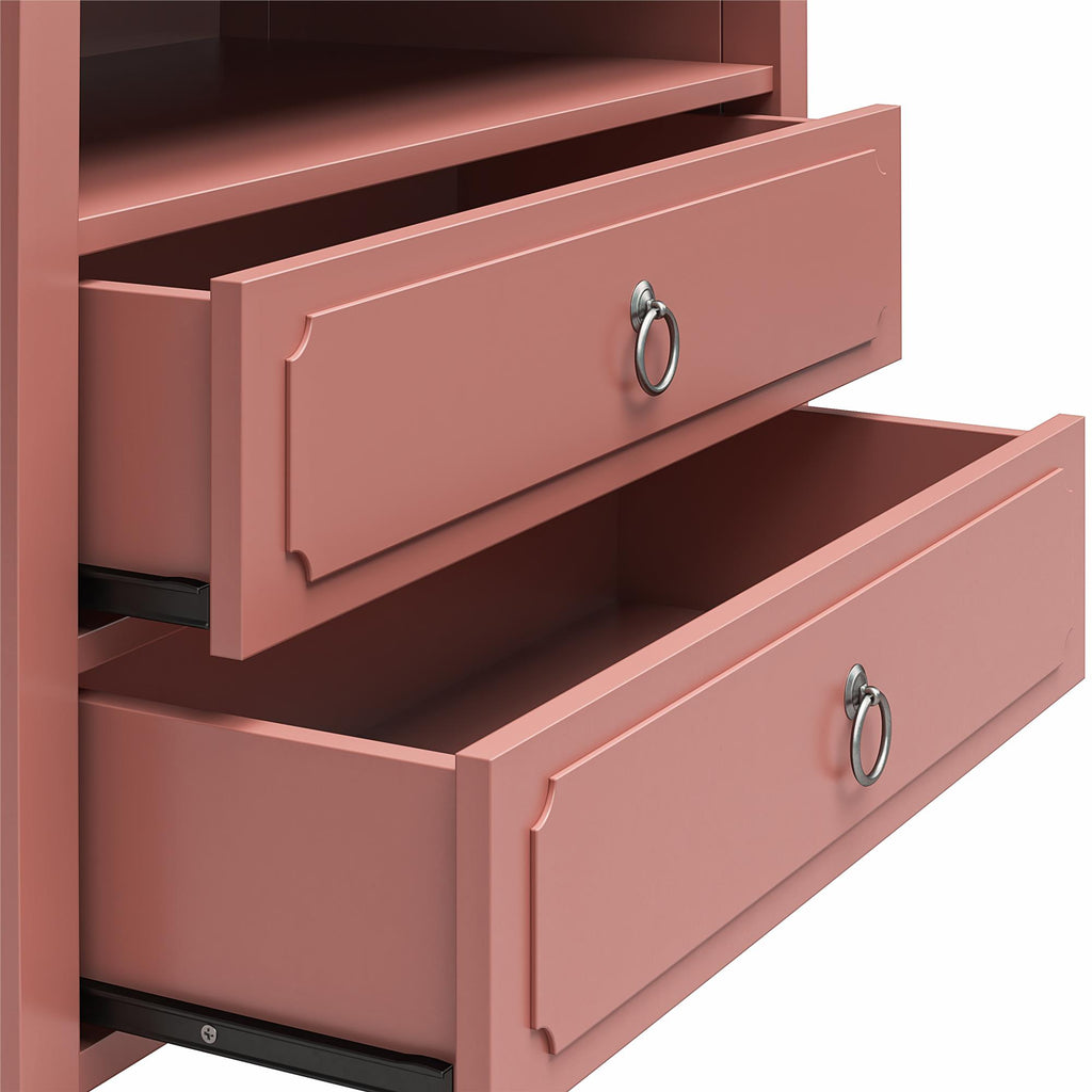 Close-up of the pink Her Majesty 2 Drawer Nightstand featuring partially open drawers, each with a round metal handle. Its design displays simple, elegant lines and a decorative border on the front panels, epitomizing elegance.